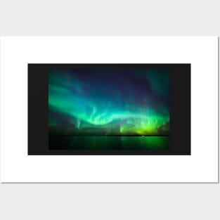 Northern lights glow over lake Posters and Art